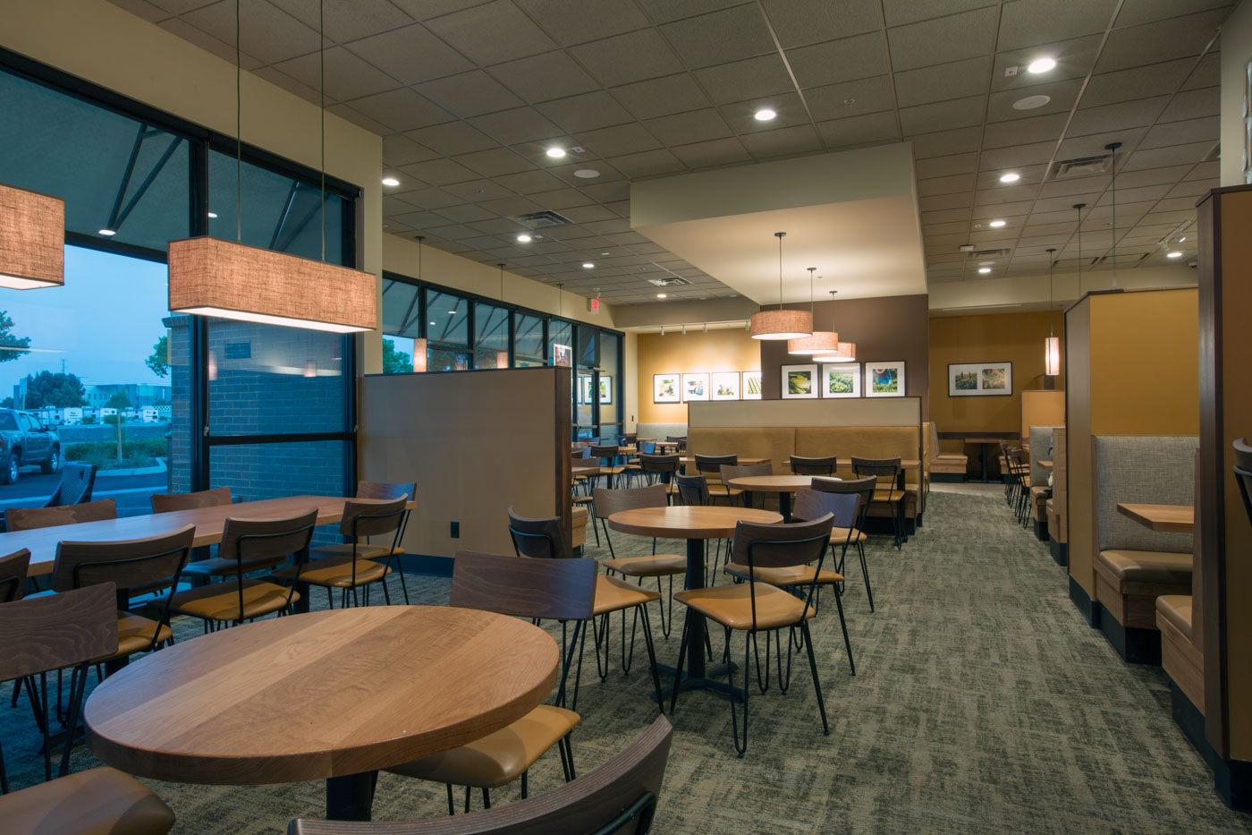 Modern Panera Bread cafe interior with warm wood and contemporary seating